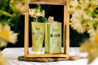 Naturally Radiant Brightening Hot Cloth Cleanser with fresh floral background.